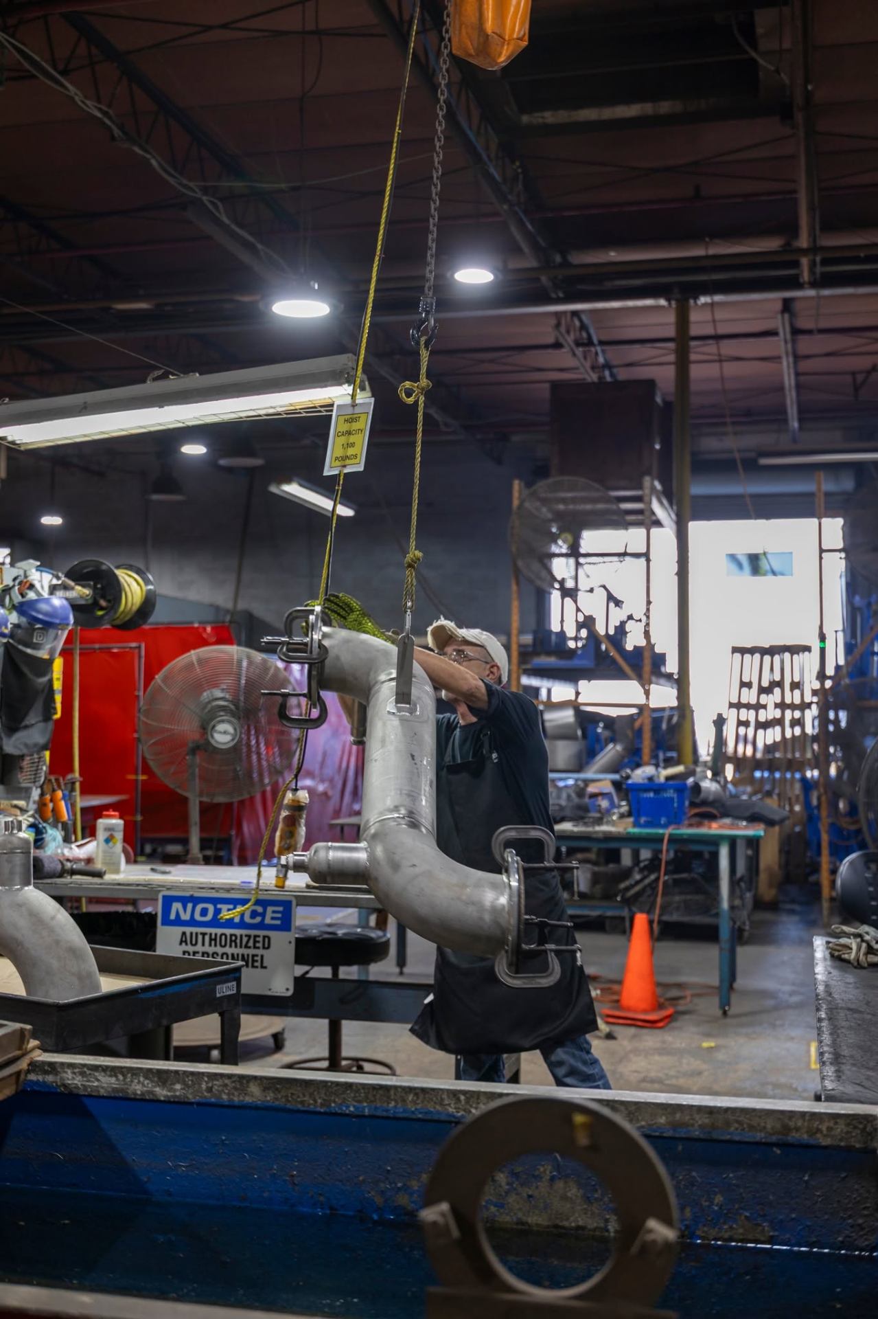 Fitter Hoisting a Stainless Run